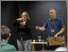 [thumbnail of Image from LAA Project of Adrian Bossey and BSL Interpreter speaking to students from Deaf Academy at the DJ workshop]